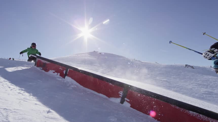 Skiers jump on a ramp