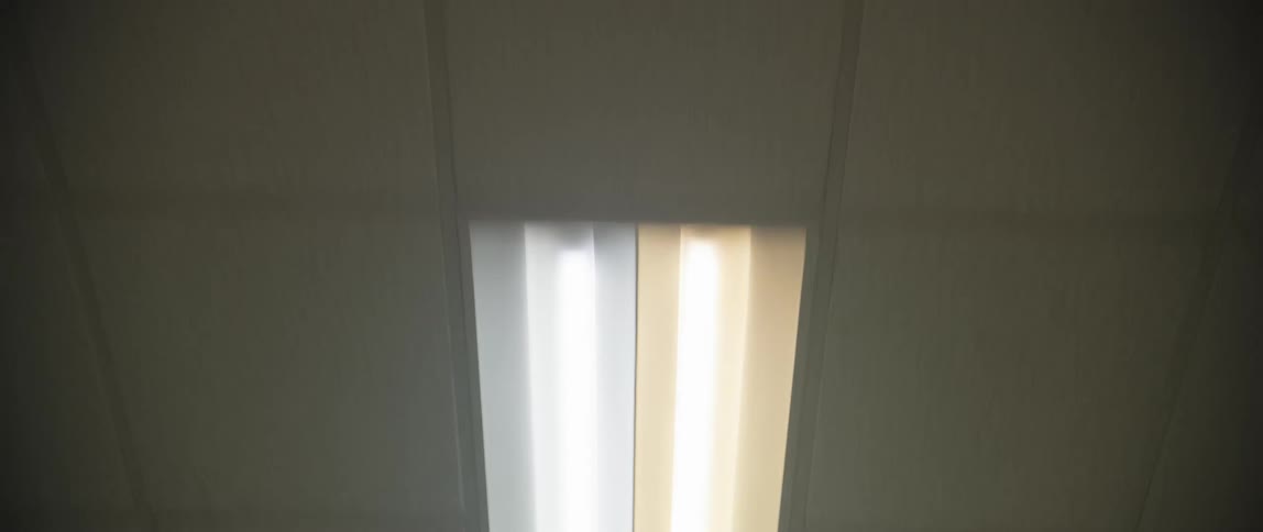 Lights on the ceiling alternate between turned on and off