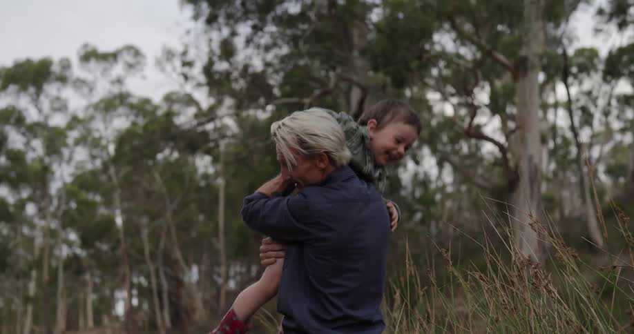 A footage of a man playing with a young boy