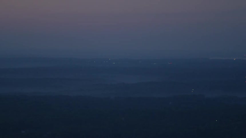 A foggy city with pinpoints of light