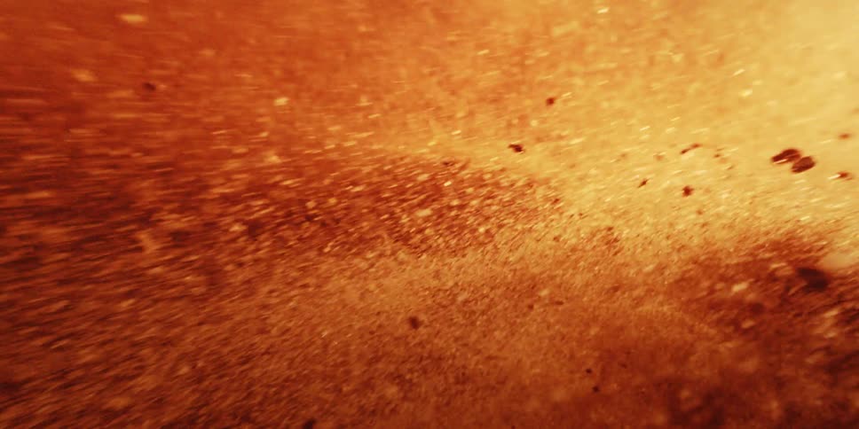 Macro closeup of atoms and particles being incinerated from the destruction of a planet