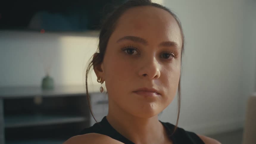 Close up of womans face in a living room