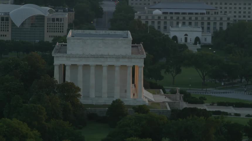 Aerial view of large city buildings at sunset