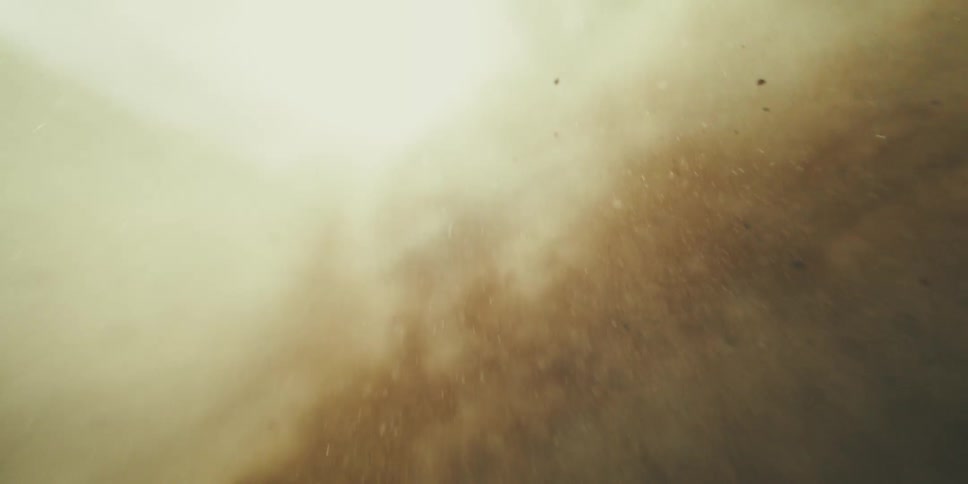 Extreme close up of sand churning on surface of ocean floor