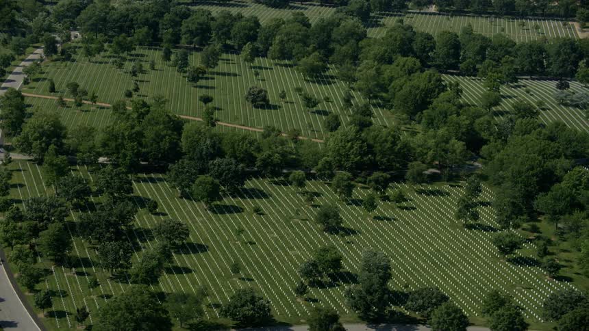 The fields below have many graves and trees