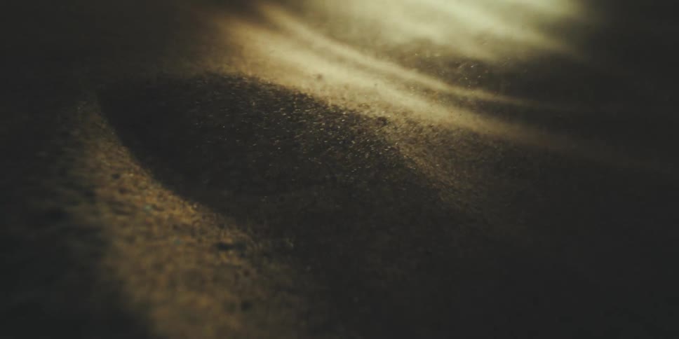 Sand moves around as light hits it in different ways