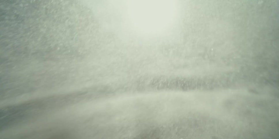 Inside a Nighttime Sandstorm With Particles Swirling Through Darkness