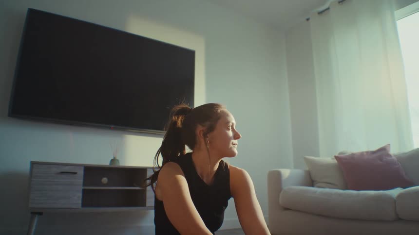 Woman sitting in living room