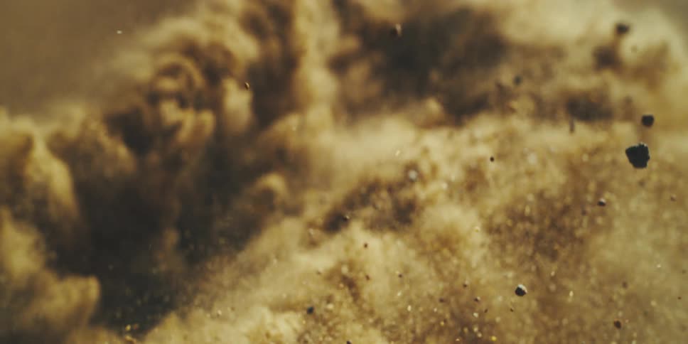 Slow Motion Eruption as Sandy Debris Lifts From a Violent Impact