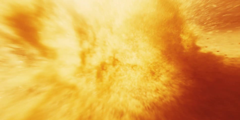 POV flying inside the sun as bright orange and yellowing lava fly past camera