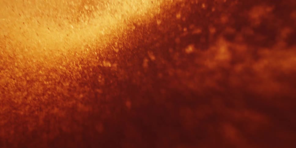 Suspended Particles Drifting Inside a Molten Wave of Heat