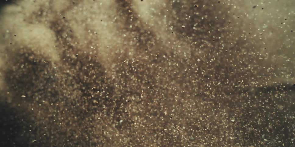 Dirt and sand explodes through the air during a cataclysm