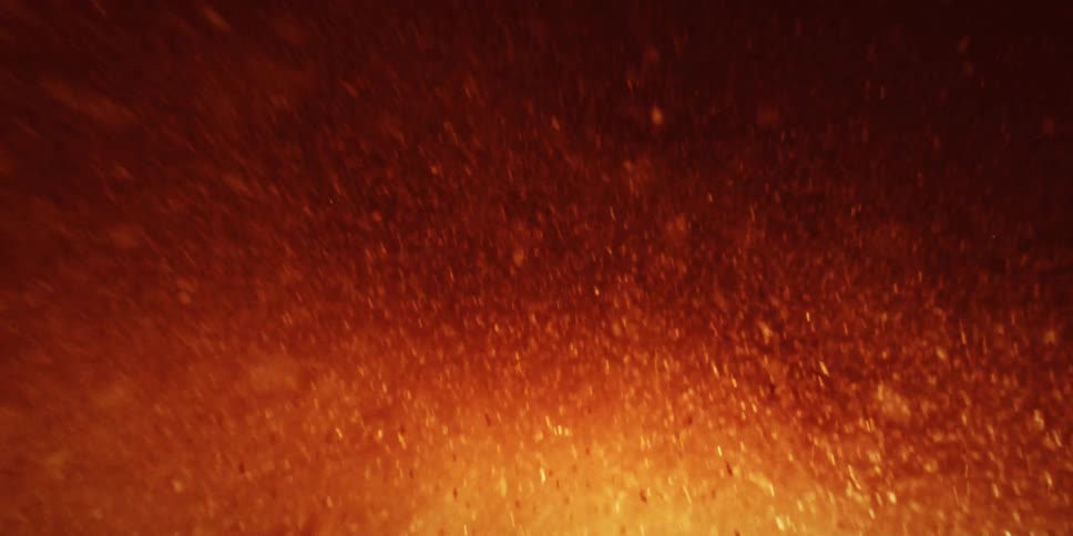 Inside an explosion of fiery particles moving randomly and quickly through space