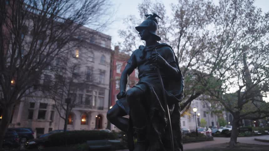 Bronze statue of a warrior in a square in the city