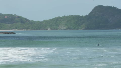 People floating in the ocean on a clear day
