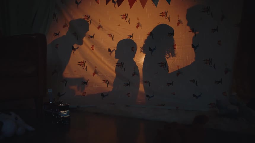 A shadow clip of people behind the curtain