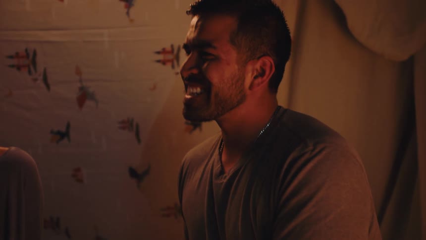 A woman and a man talking and laughing