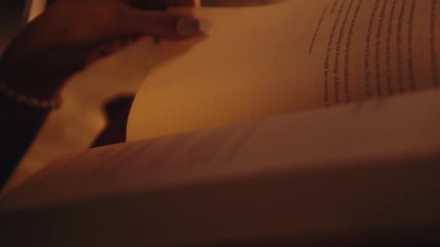 A footage of a person reading a book