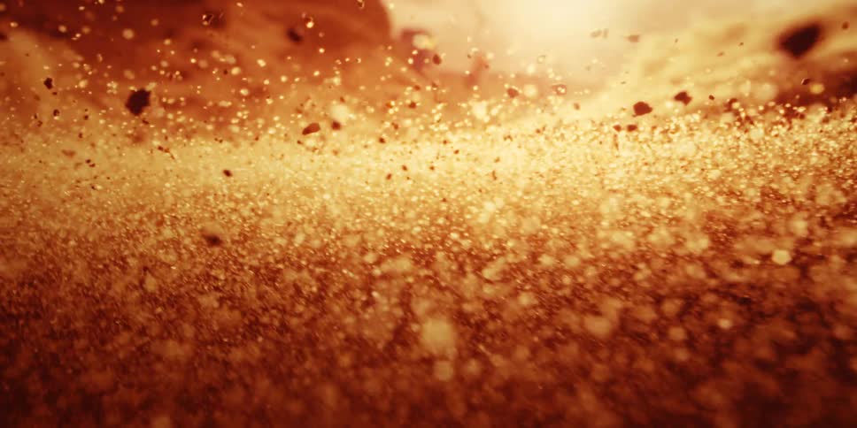 Slowmotion dust and sand particles fly upwards inside a tornado