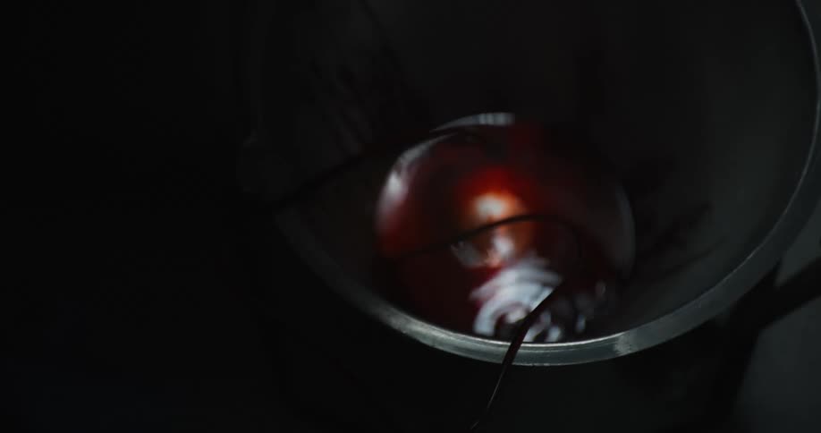 Blood flows through the tube into the metal bucket