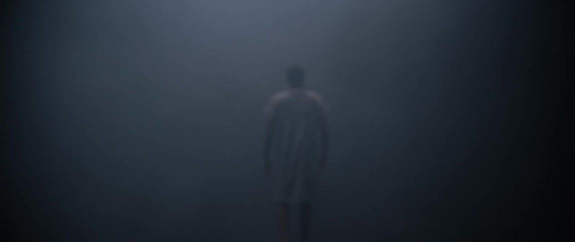 Hospital patient walking in darkness and fog