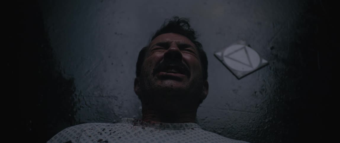 A man is screaming in pain