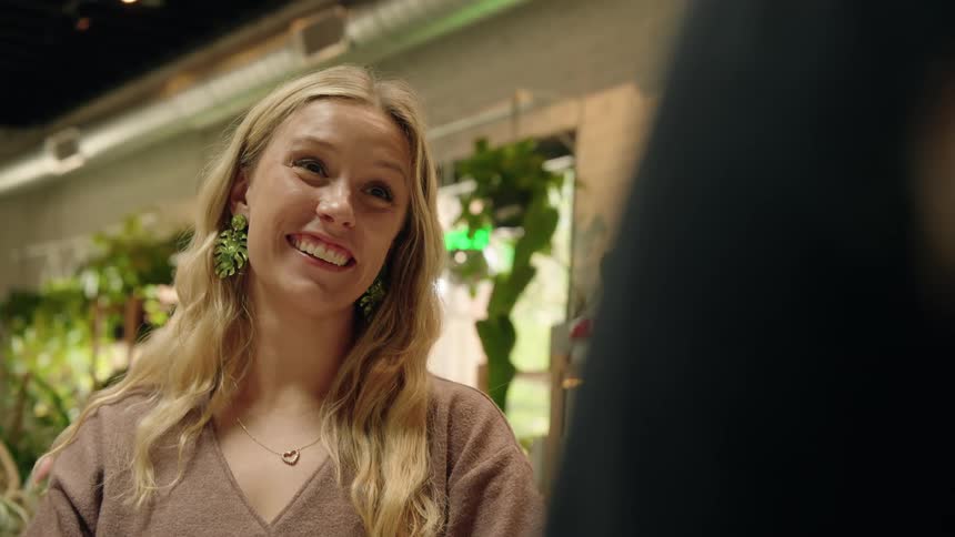 Smiling blonde woman sitting talking