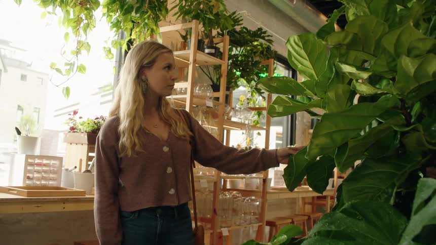 Blonde woman walking inside an establishment
