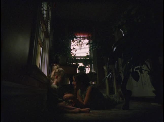 Sisters play in the dark room
