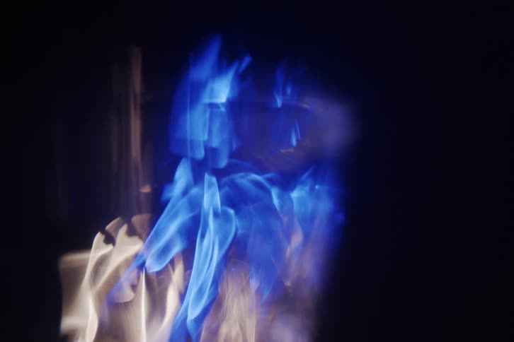 A blue and white lights display creating various shapes on a black background