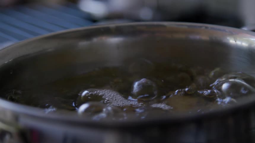 A cooking pan with boiling hot water