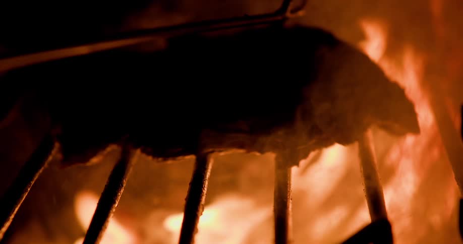 Food is being grilled over open flames