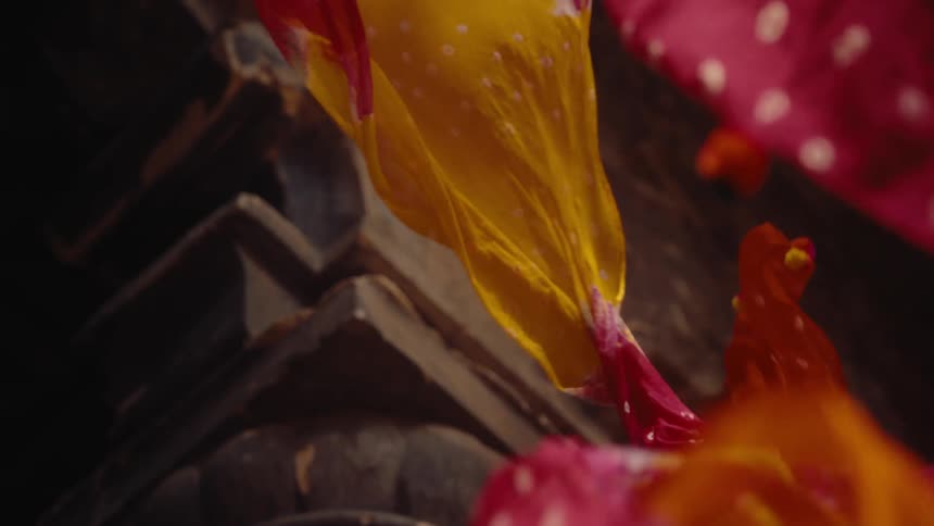The scarfs float as they fall down