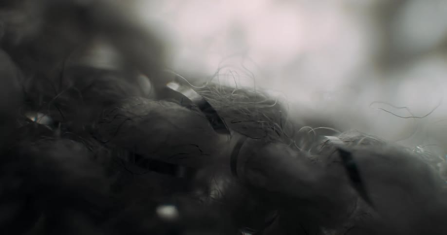 A piece of material sits in the dark area