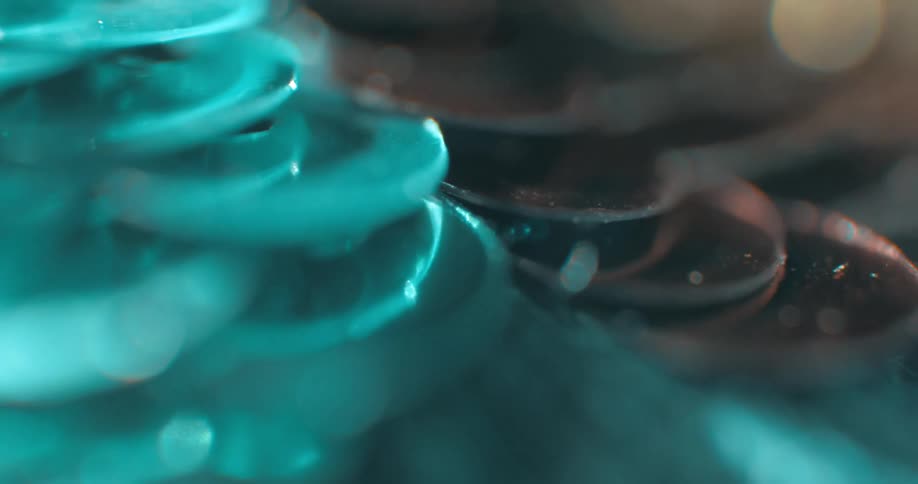 Small colored discs are embroidered on the fabric