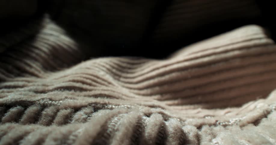 A light shines on the brown fabric