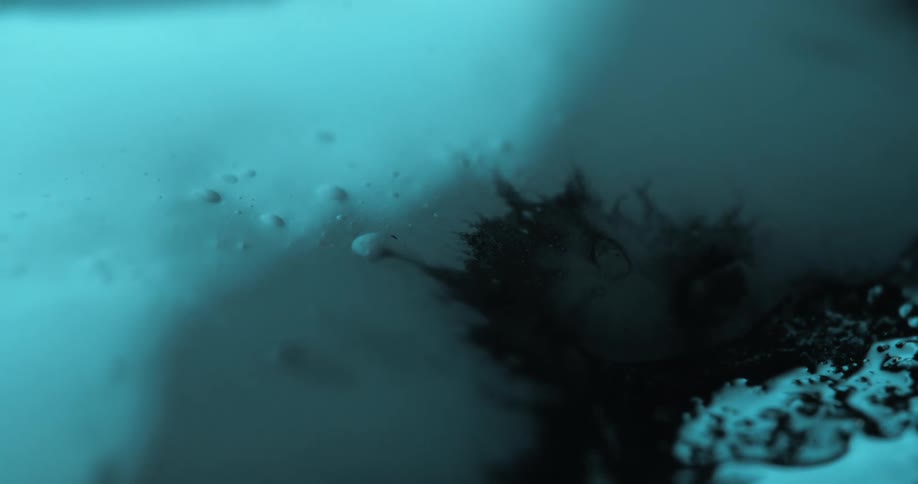 The black ink slowly spreads