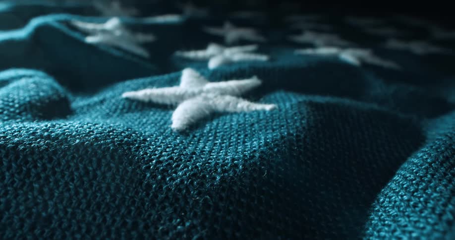 The american flag has embroidered stars on it