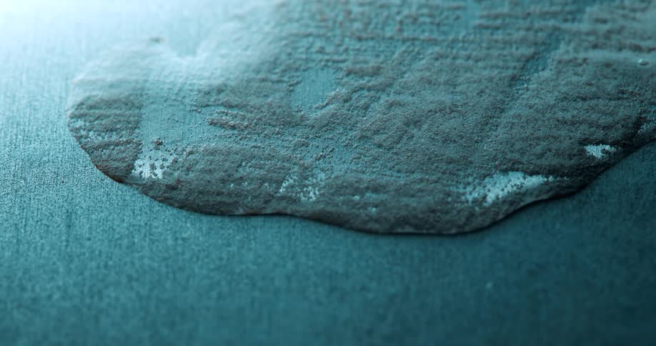 The liquid slowly erodes the surface
