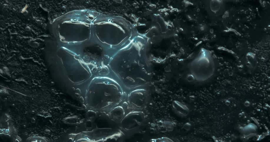 The liquid slowly bowls and pops