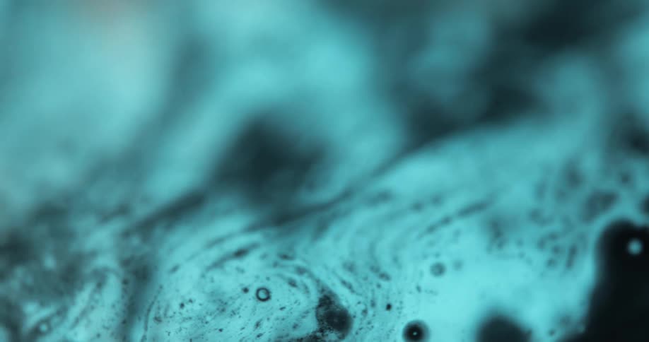The turquoise object has black dots