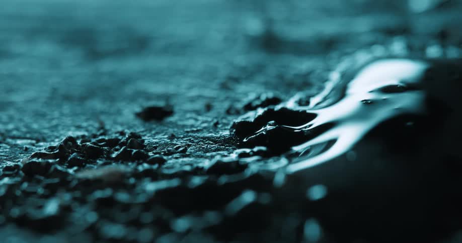 The light slowly shines on the liquid reflecting off it