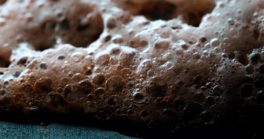 The bubbles on the foam are slowly popping