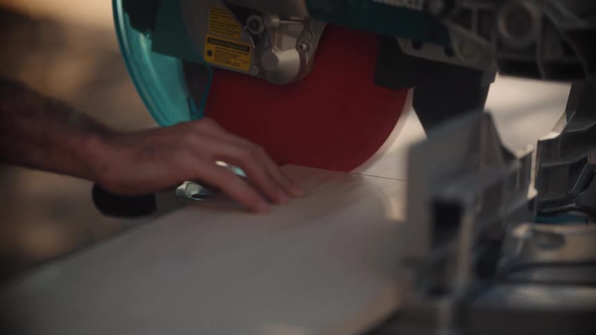 Cutting a piece of lumber with a circular saw