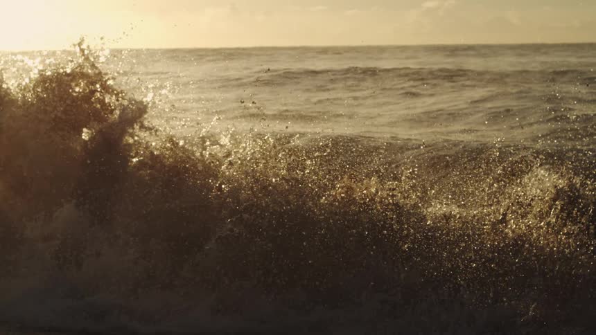 Sunlight shining on the sea with strong waves