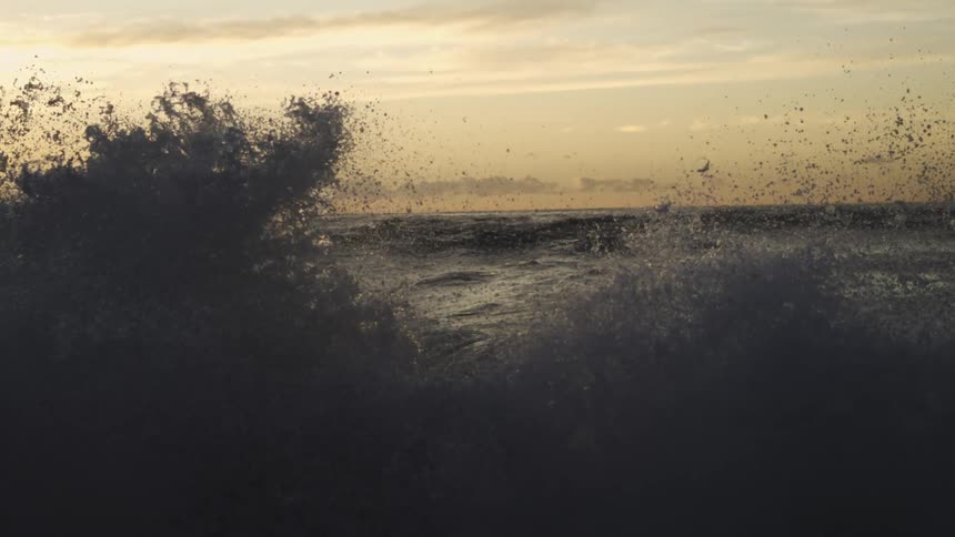 Close up of sea waves at sunset