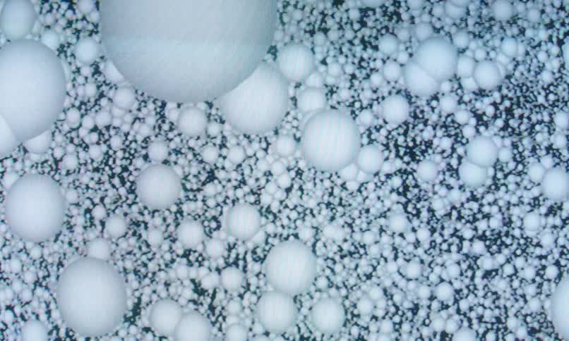 White balls of equal sizes on a dimensional background