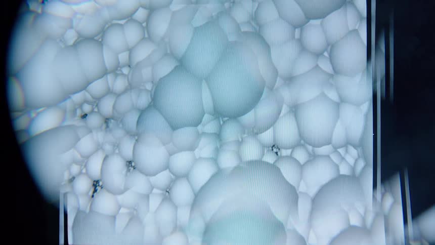 A huge amount of white orbs are sticking together in the digital art