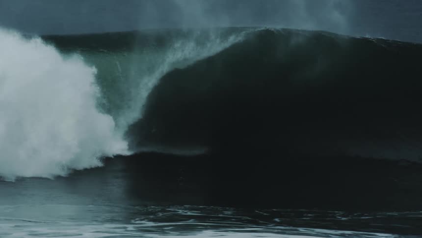 A large wave in the shape of a barrel