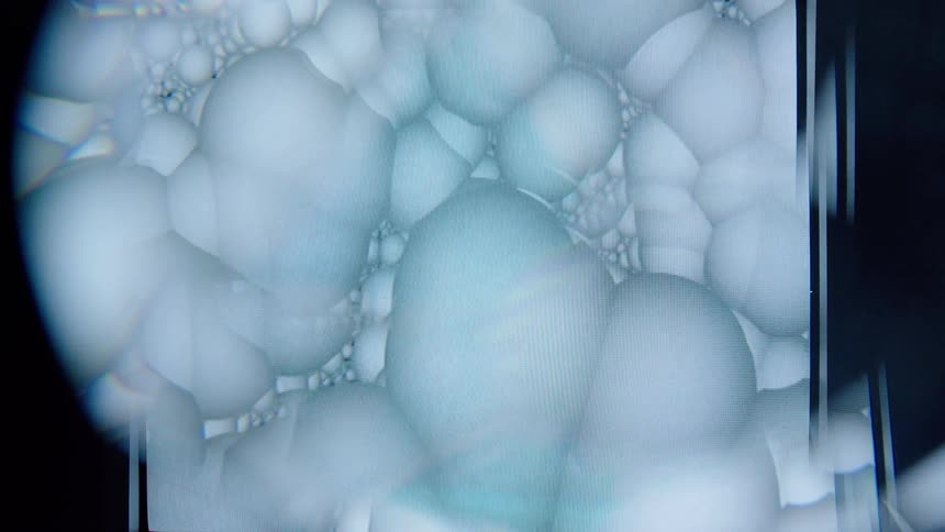 Abstract cgi of floating white spheres in slow motion